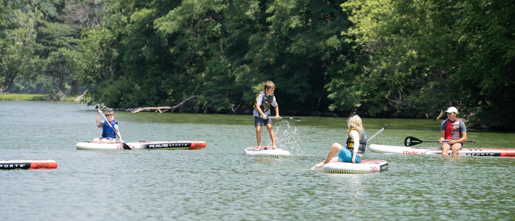 Iowa Wildlife campers take to the water on paddle boards 