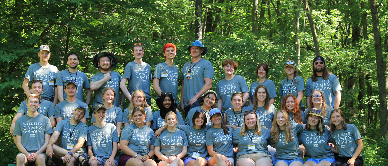 Staff of Iowa Wildlife Camps pose for a group photo. 