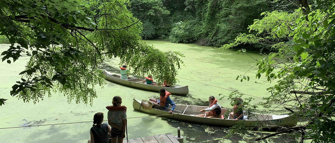 UI Wild campers at the lake, on the peer, and in canoes 