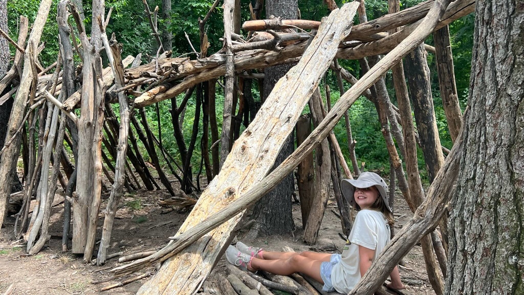 UI Wild camper resting in the woods