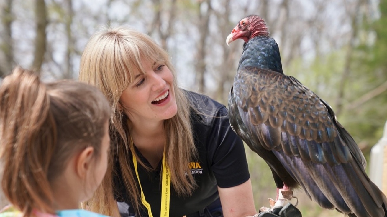 IRP staff, student, and raptor